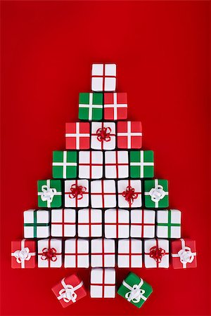 falling with box - Christmas tree made of tiny gift boxes - holidays concept on red background Stock Photo - Budget Royalty-Free & Subscription, Code: 400-07293101