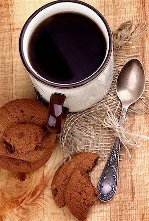 simsearch:400-07420117,k - Arrangement of Rustic Cup of Black Tea with Chocolate Chip Cookies and Tea Spoon closeup on Wooden background. Top View Stock Photo - Budget Royalty-Free & Subscription, Code: 400-07293265