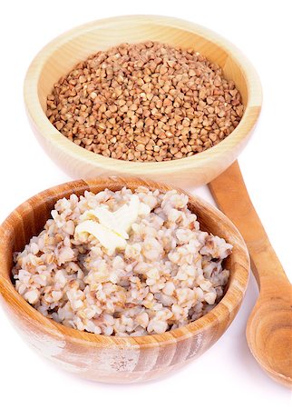 Arrangement of Traditional Russian Buckwheat Kasha with Buckwheat in Wooden Bowl and Wooden Spoon isolated on white background Stock Photo - Budget Royalty-Free & Subscription, Code: 400-07293262