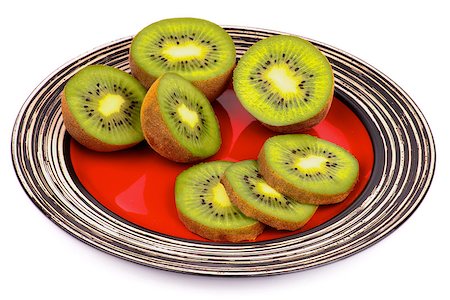 simsearch:400-05265200,k - Perfect Ripe Kiwi Halves and Slices on Striped Red Plate isolated on white background Photographie de stock - Aubaine LD & Abonnement, Code: 400-07293271