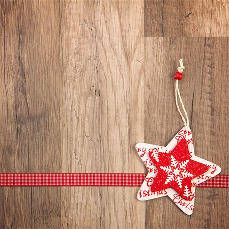 simsearch:400-07920008,k - Christmas decoration with wood background, Christmas star red with ribbon Fotografie stock - Microstock e Abbonamento, Codice: 400-07293289