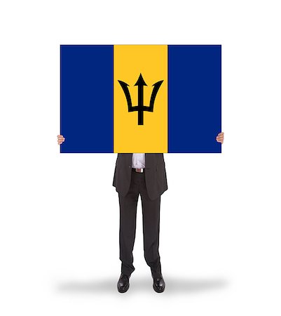 signs in barbados - Businessman holding a big card, flag of Barbados Stock Photo - Budget Royalty-Free & Subscription, Code: 400-07293307