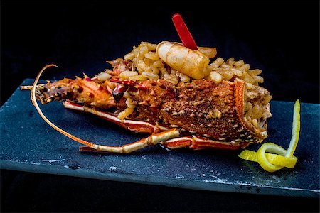 seafood risotto - spanish rice with prawn and vegetables served on black tray Stock Photo - Budget Royalty-Free & Subscription, Code: 400-07293364