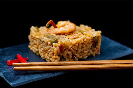 rice and beans - spanish rice with prawn and vegetables served on black tray Stock Photo - Budget Royalty-Free & Subscription, Code: 400-07293363