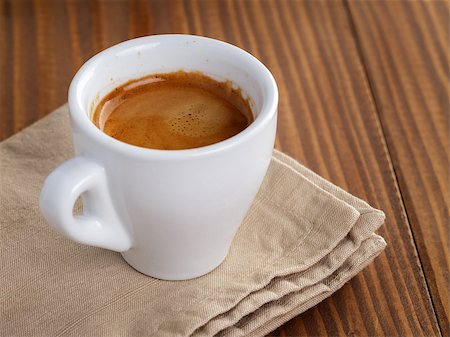 frezshly made cup of double espresso, on wooden table Stock Photo - Budget Royalty-Free & Subscription, Code: 400-07304081
