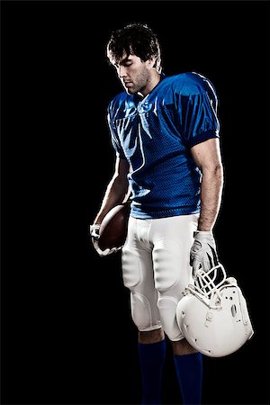 simsearch:6109-08389992,k - Football Player with number on a blue uniform and a ball in the hand. Studio shot. Stock Photo - Budget Royalty-Free & Subscription, Code: 400-07304216