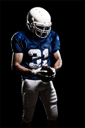 simsearch:6109-08389992,k - Football Player with number on a blue uniform and a ball in the hand. Studio shot. Stock Photo - Budget Royalty-Free & Subscription, Code: 400-07304210