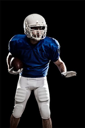simsearch:6109-08389992,k - Football Player with number on a blue uniform and a ball in the hand. Studio shot. Stock Photo - Budget Royalty-Free & Subscription, Code: 400-07304213