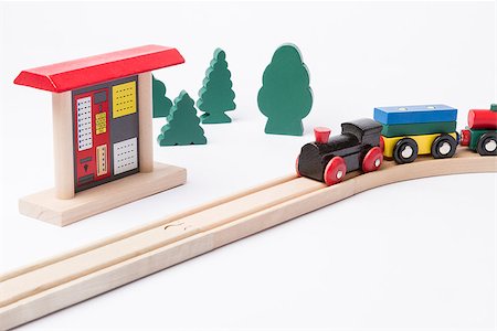 toy ticket machine at wooden railroad track with some trees in background Stock Photo - Budget Royalty-Free & Subscription, Code: 400-07304228