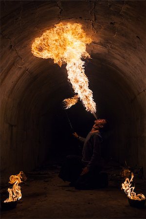 Fire artist blowing fire from his mouth Stock Photo - Budget Royalty-Free & Subscription, Code: 400-07304302