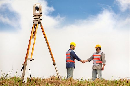 simsearch:400-04710606,k - two Surveyor engineers handshaking on the field Stock Photo - Budget Royalty-Free & Subscription, Code: 400-07304334