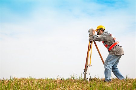 simsearch:400-07304331,k - Surveyor engineer making measure on the field Stock Photo - Budget Royalty-Free & Subscription, Code: 400-07304330