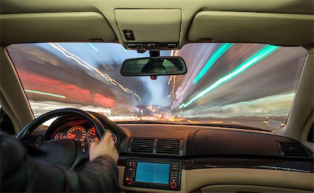 Car interior on driving. Blurred night lights Fotografie stock - Microstock e Abbonamento, Codice: 400-07304516