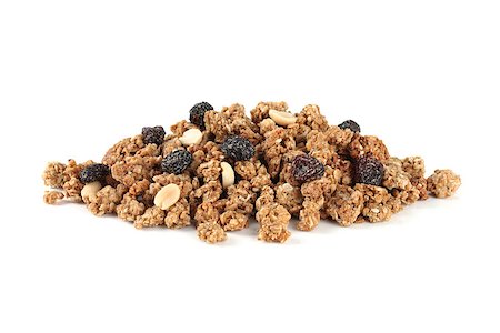 a pile of muesli on a white background Fotografie stock - Microstock e Abbonamento, Codice: 400-07304586