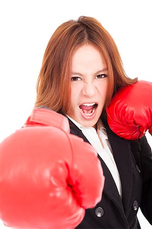 simsearch:400-04333650,k - Businesswoman boxing punching towards and ready to fight Stock Photo - Budget Royalty-Free & Subscription, Code: 400-07304657