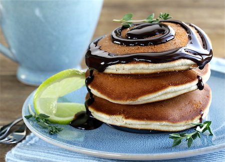 pancake bake - homemade pancakes with chocolate syrup and thyme Stock Photo - Budget Royalty-Free & Subscription, Code: 400-07304807