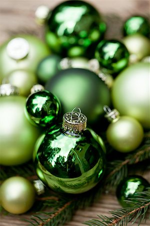 shiny green christmas baubles closeup macro and tree on wooden background Stock Photo - Budget Royalty-Free & Subscription, Code: 400-07304909