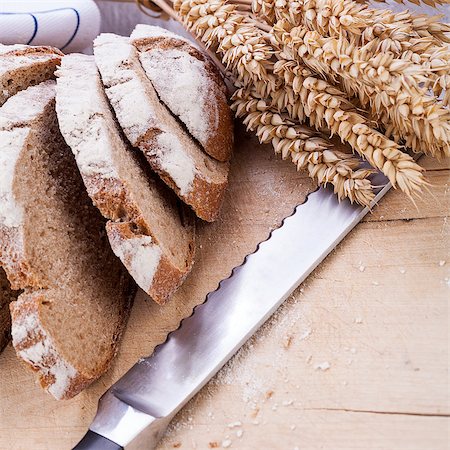 simsearch:400-05744487,k - homemade fresh baked bread and knife on wooden table Stock Photo - Budget Royalty-Free & Subscription, Code: 400-07305031