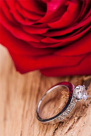 simsearch:400-07306125,k - beautiful ring on wooden background and red rose present valentines Stock Photo - Budget Royalty-Free & Subscription, Code: 400-07305101