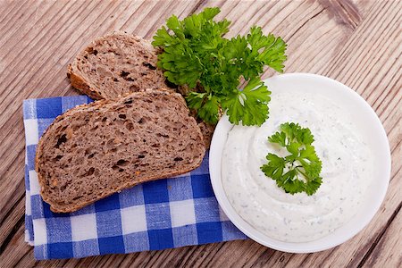quark bread - fresh tasty herbal creme cheese and bread on wooden table Stock Photo - Budget Royalty-Free & Subscription, Code: 400-07305154