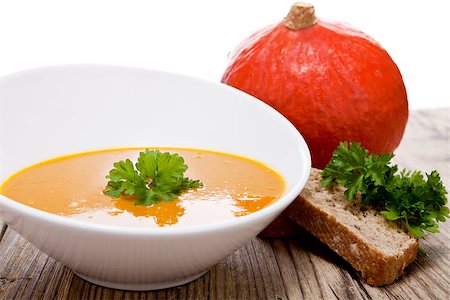 simsearch:400-07828867,k - fresh tasty homemade pumpkin soup on wooden table with parsley and bread Photographie de stock - Aubaine LD & Abonnement, Code: 400-07305168