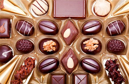 simsearch:400-04295091,k - collection of different sweet chocolate pralines closeup background present sugar Photographie de stock - Aubaine LD & Abonnement, Code: 400-07305207