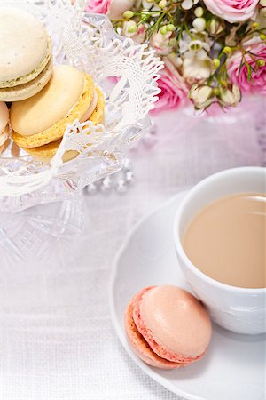 pink macaroon - traditional delicious sweet dessert macarons and coffee on table Stock Photo - Budget Royalty-Free & Subscription, Code: 400-07305203