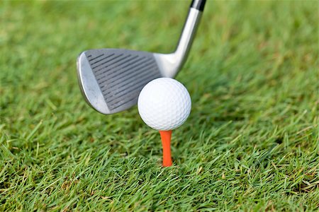 golf ball and iron on green grass detail macro summer outdoor playing golf Stock Photo - Budget Royalty-Free & Subscription, Code: 400-07305287