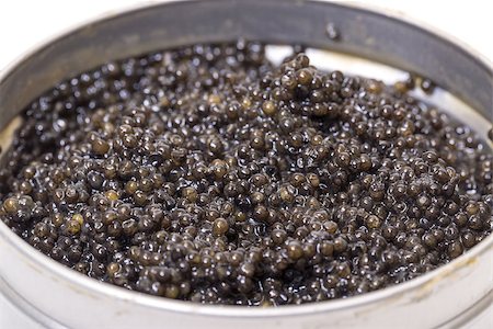 Black caviar in metal can, high angle on white background Stock Photo - Budget Royalty-Free & Subscription, Code: 400-07305404