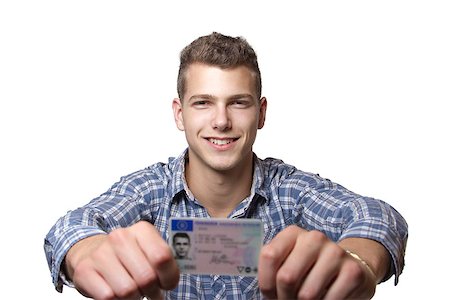 drivers licence - Young man just recieved his drivers license and is happy to drive his own car soon Stock Photo - Budget Royalty-Free & Subscription, Code: 400-07305438