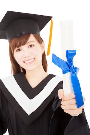 simsearch:400-07305822,k - Young graduate girl student holding and showing diploma Stock Photo - Budget Royalty-Free & Subscription, Code: 400-07305823