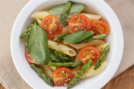 roasted tomatoes above - italian pasta penne with tomatoes and asparagus, from above Stock Photo - Budget Royalty-Free & Subscription, Code: 400-07306285
