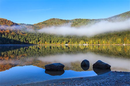Autumn landscape at Saint Anna Lake which is located in a volcanic crate from Romania Stock Photo - Budget Royalty-Free & Subscription, Code: 400-07306321