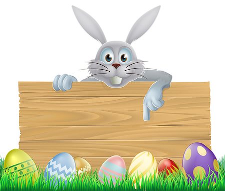 simsearch:400-07307426,k - Easter eggs and Easter bunny sign with the Easter bunny peeping over the sign and pointing at the message Stock Photo - Budget Royalty-Free & Subscription, Code: 400-07306418
