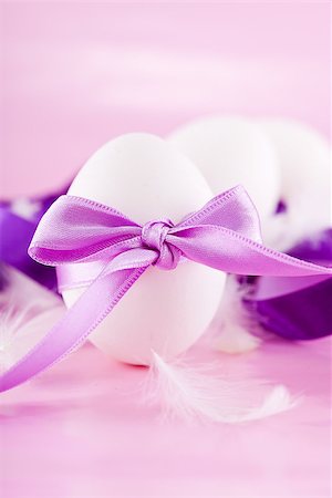 simsearch:400-06527401,k - festive traditional easter egg decoration purple satin ribbon on pink Stock Photo - Budget Royalty-Free & Subscription, Code: 400-07306885