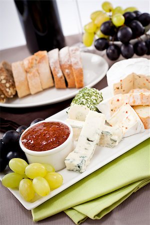 simsearch:400-03992643,k - different cheese types on plate with grapes and red wine on wooden table Stock Photo - Budget Royalty-Free & Subscription, Code: 400-07307128