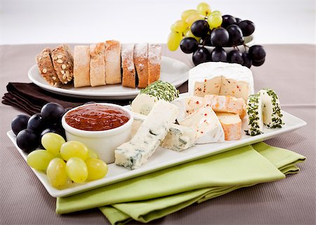 simsearch:400-04040057,k - different cheese types on plate with grapes and red wine on wooden table Stock Photo - Budget Royalty-Free & Subscription, Code: 400-07307120