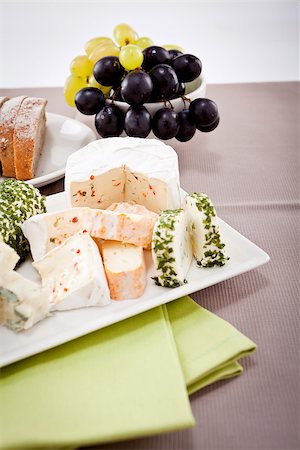 simsearch:400-04040057,k - different cheese types on plate with grapes and red wine on wooden table Stock Photo - Budget Royalty-Free & Subscription, Code: 400-07307121