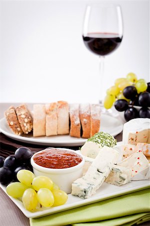 simsearch:400-04040057,k - different cheese types on plate with grapes and red wine on wooden table Stock Photo - Budget Royalty-Free & Subscription, Code: 400-07307122