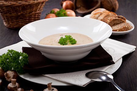 fresh chmapignon cream soup with parsley decorated on wooden table Stock Photo - Budget Royalty-Free & Subscription, Code: 400-07307146