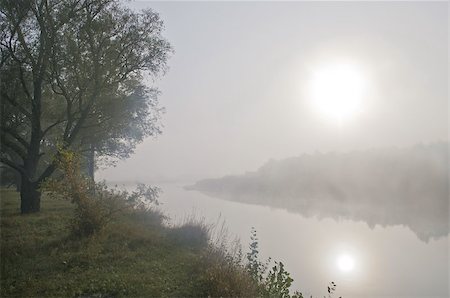 It is the beginning of autumn. The river is folded in mist. Stockbilder - Microstock & Abonnement, Bildnummer: 400-07307260