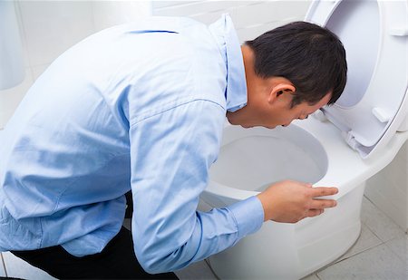 simsearch:695-05764382,k - Young man drunk or sick vomiting Stock Photo - Budget Royalty-Free & Subscription, Code: 400-07307839