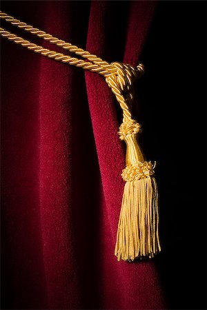 simsearch:400-07682178,k - Red velvet curtain with tassel. Close up black isolated curtain Photographie de stock - Aubaine LD & Abonnement, Code: 400-07308310