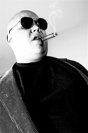 simsearch:400-05005666,k - Black and white photo of a cigar smoking gangster.  Harsh lighting for more disturbing look. Foto de stock - Super Valor sin royalties y Suscripción, Código: 400-07309248