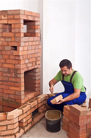 simsearch:400-04494971,k - Worker building masonry heater with bricks and clay Stock Photo - Budget Royalty-Free & Subscription, Code: 400-07309424