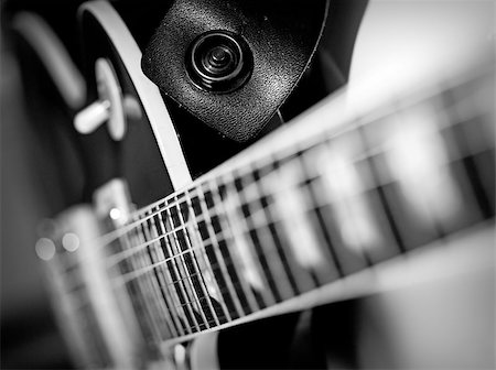 simsearch:400-08134650,k - Macro abstract black and white photo of the neck and frets of an electric guitar. Stock Photo - Budget Royalty-Free & Subscription, Code: 400-07309518