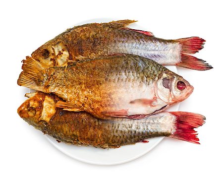 simsearch:400-05909845,k - Frying of fish. Half of raw and fried fish on a plate, isolated on white background. Foto de stock - Super Valor sin royalties y Suscripción, Código: 400-07300113