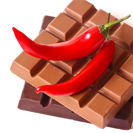 simsearch:400-08789726,k - Dark and milk chocolate bars with chili on white. Photographie de stock - Aubaine LD & Abonnement, Code: 400-07300132