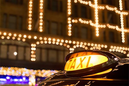 shopping center city center europe - Taxi in London in front of a shopping center in the night Stock Photo - Budget Royalty-Free & Subscription, Code: 400-07300903