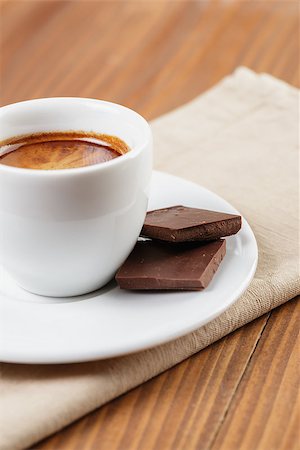 simsearch:400-07306295,k - freshly made espresso shot with chocolate, on wooden table Stock Photo - Budget Royalty-Free & Subscription, Code: 400-07301325